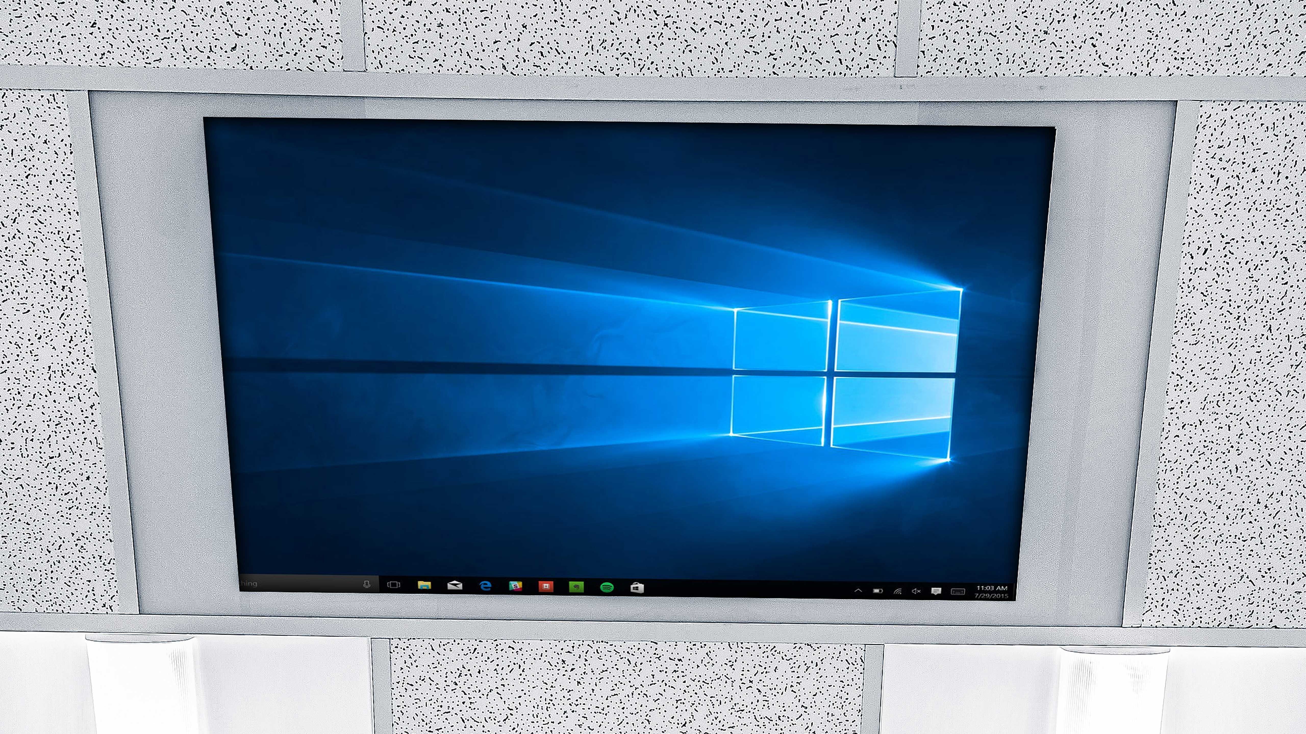 A monitor embedded in the office wall.